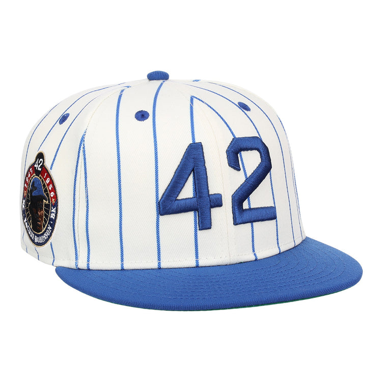 The EFF Jackie Robinson EFF Signature Series Fitted Ballcap - Pinstripe features blue pinstripes, a blue brim, 3D embroidered 42 on the front, and a circular patch with red, white, and blue accents on the side.