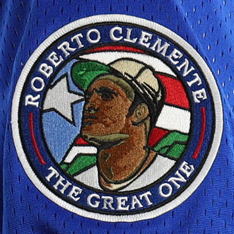 The EFF Roberto Clemente Santurce Cangrejeros NL Replica V-Neck Mesh Jersey in royal features vintage-inspired styling, honoring The Great One with ROBERTO CLEMENTE lettering and a Puerto Rican flag background.