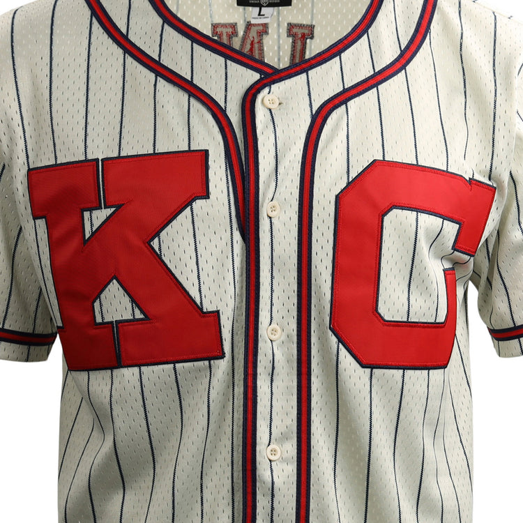 The EFF Jackie Robinson Kansas City Monarchs Vintage Inspired NL Replica Button-Up Mesh Jersey features white pinstripes, bold red “K” and “C” letters outlined in blue, capturing classic Negro National League style.