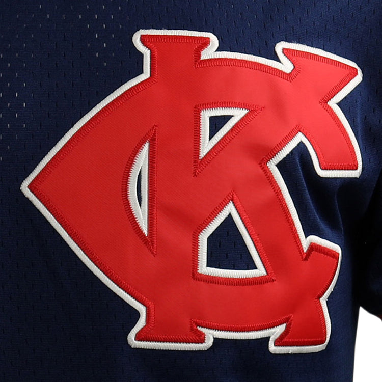 A close-up of the EFF Jackie Robinson Kansas City Monarchs Vintage Inspired NL Replica V-Neck Mesh Jersey, navy blue mesh with a bold red and white overlapping KC patch on the front.