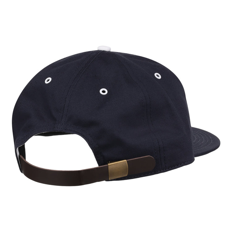 The EFF Binghamton Triplets Cotton Twill Ballcap is a navy blue, vintage-inspired cap with white eyelets and an adjustable leather strap with a brass buckle, reminiscent of classic New York-Penn League styles.