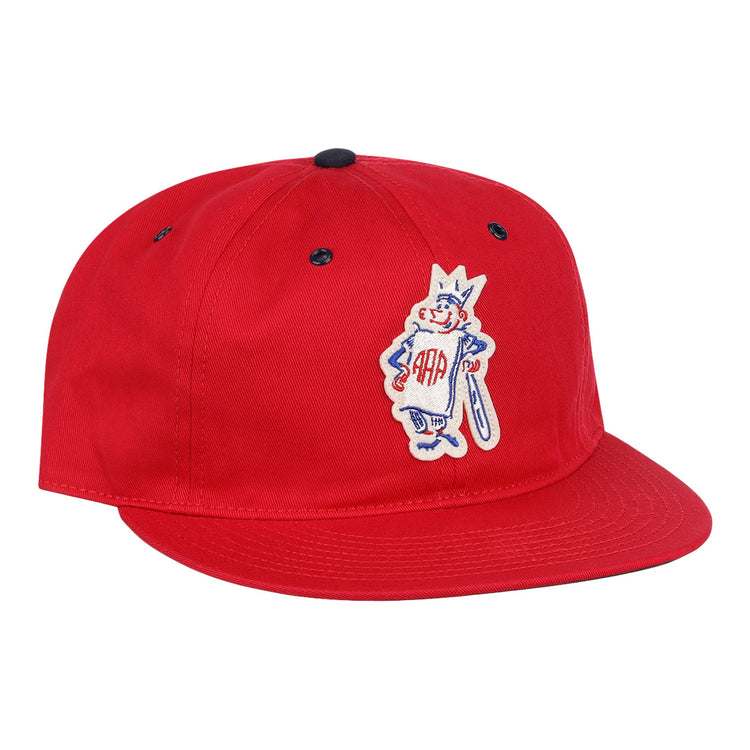 The Havana Sugar Kings Cotton Twill Ballcap by EFF is a red cotton cap with a flat brim, cartoon character embroidery—crowned, bat in hand, “AAA” on the chest—and a Beisbolito patch inspired by the Cuban League.