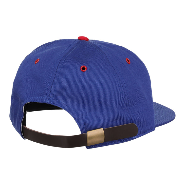 The EFF Montreal Royals Cotton Twill Ballcap is blue cotton, shown from the back with a brown adjustable strap and brass buckle, red embroidered eyelets, and a stylish Royals patch for extra flair.