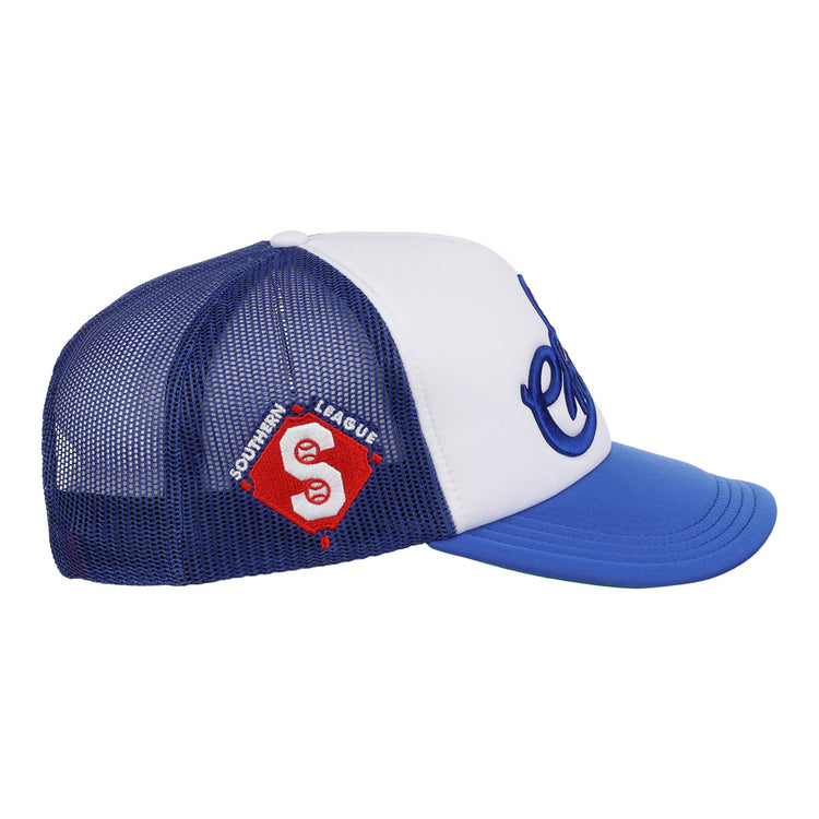 The EFF Memphis Chicks EFF MiLB Vintage Foam Trucker is a blue and white hat with a curved blue brim, a red and white Southern League patch, and cursive blue lettering on the front, inspired by the original Memphis Chicks hat.