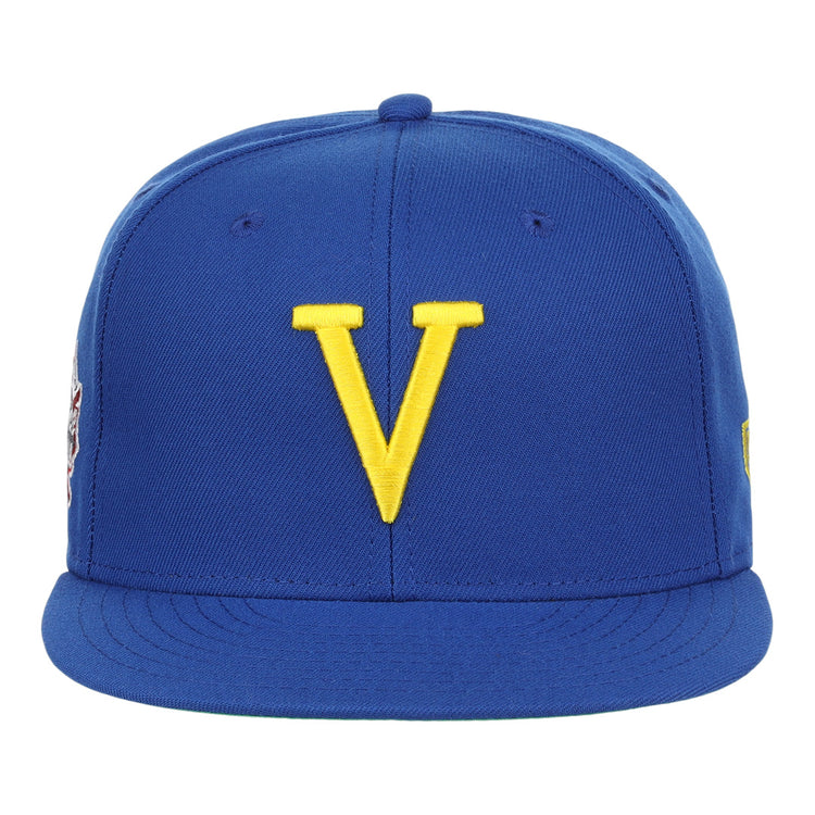The Vermont Mariners EFF MiLB Vintage Snapback by Ebbets Field Flannels is a blue cap with a yellow V embroidered on the front, featuring an adjustable snapback for comfort and subtle side logos not easily seen from the front.