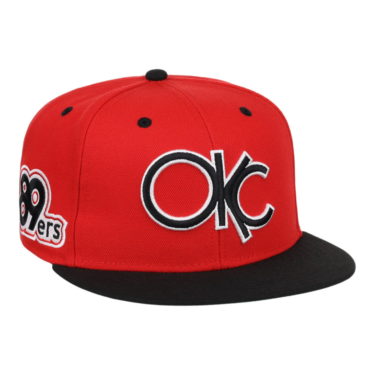 The Oklahoma City 89ers EFF MiLB Vintage Snapback by Ebbets Field Flannels is a red and black adjustable hat with a large OKC logo front and an 89ers side patch, from our Vintage Minor League collection.