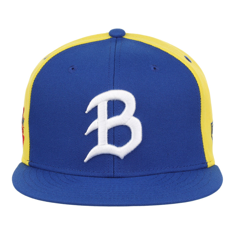 The Burlington Bees EFF MiLB Vintage Snapback by Ebbets Field Flannels features a blue bill and front panel, yellow side panels, a white B embroidered on the front, and a snapback closure for an adjustable fit.