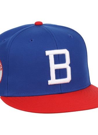 The Buffalo Bisons EFF MiLB Vintage Snapback by Ebbets Field Flannels features a blue crown, red brim, white “B” front logo, and bison side patch—an adjustable hat celebrating classic style from the Vintage Minor League collection.