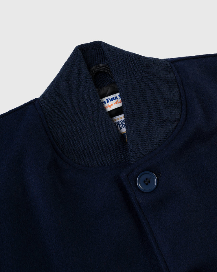 Close-up of the collar and top button on the EFF Cincinnati Reds 1942 Authentic All Wool Varsity Jacket, featuring a ribbed knit collar, visible interior brand tags, and smooth, slightly textured wool fabric.