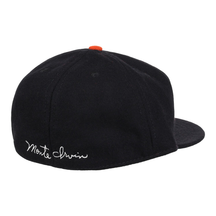 The Ebbets Field Flannels Monte Irvin Signature Series Ballcap is a vintage-style wool cap in black, featuring an orange button and white cursive Monte Irvin embroidery on the back left to honor the Negro National League legend.