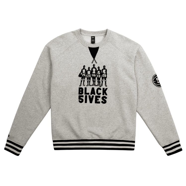 The EFF Black Fives Crewneck is a light gray sweatshirt with black striped cuffs and hem, featuring five basketball players and BLACK 5IVES on the front, plus a round patch on the left sleeveâcelebrating Black basketball history.