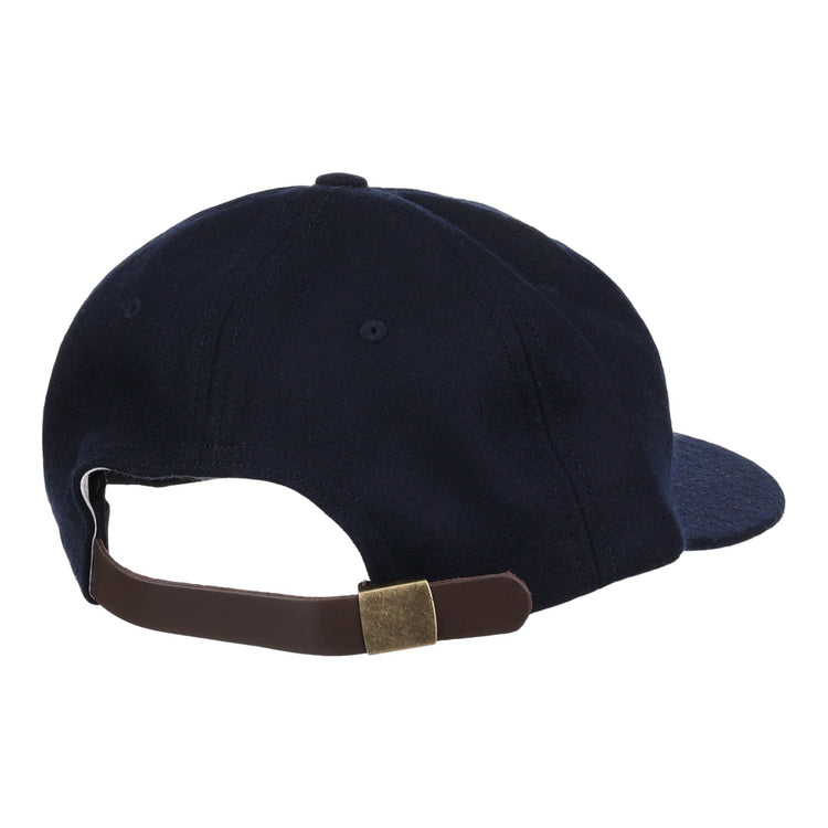 The EFF Cal State Fullerton 1965 Vintage Ballcap is shown from the back in navy blue, featuring a brown adjustable strap with a brass buckle.
