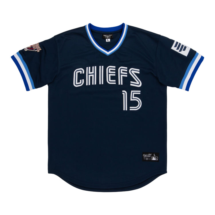 The Syracuse Chiefs EFF MiLB Vintage V-Neck Baseball Jersey by EFF is navy blue with “CHIEFS” and the number 15 in white, white and blue trim, sleeve patches, and classic International League style.