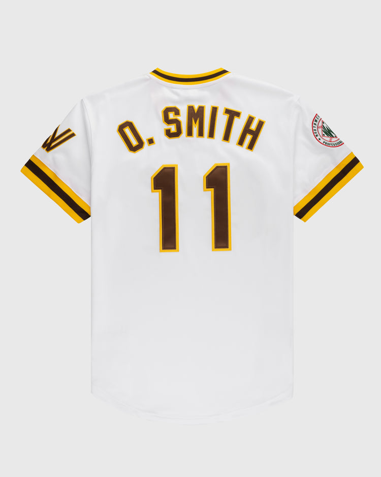 Back view of a white Walla Walla Padres Mesh V-Neck Jersey by EFF featuring brown/yellow trim, O. SMITH and number 11 in brown lettering, plus a right sleeve patch—a tribute to Ozzie Smith’s early career.