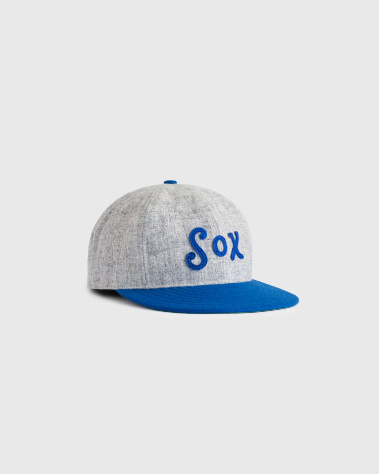 The EFF Montgomery Grey Sox 1916 Vintage Ballcap is gray with Sox embroidered in blue on the front, a bright blue brim, and honors the Negro Southern League. Shown against a plain light background.