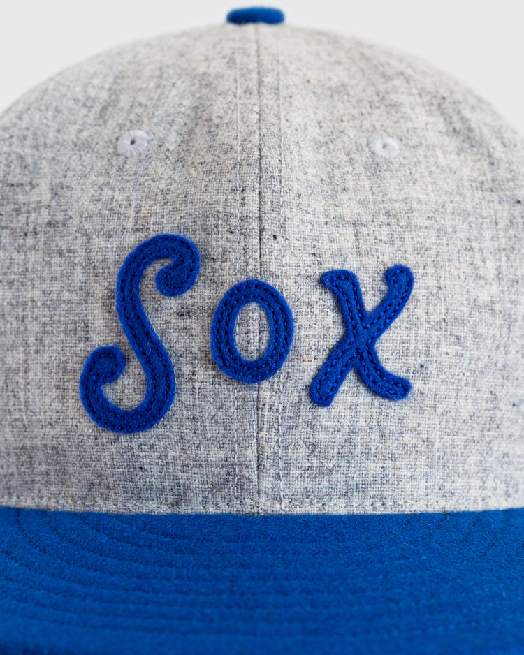 The EFF Montgomery Grey Sox 1916 Vintage Ballcap features a gray crown, blue brim, and Sox in blue cursive embroidery—a tribute to Negro Southern League history.