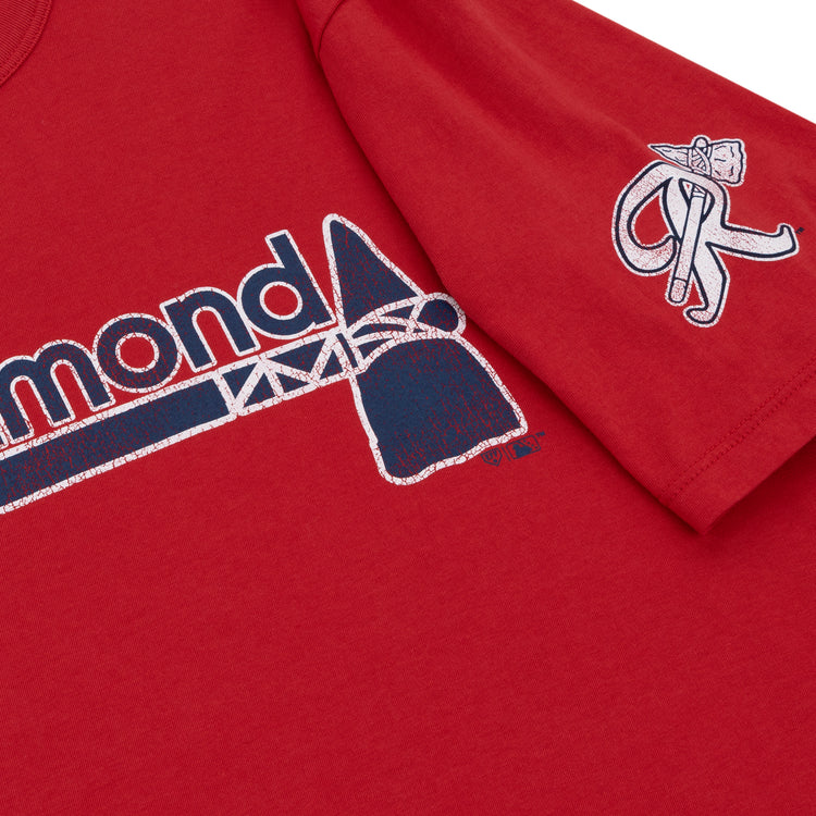 Close-up of a red Richmond Braves EFF MiLB Vintage T-Shirt by Ebbets Field Flannels, featuring Diamond in blue and white on the chest with a stylized bat, plus an embroidered International League logo with bat and glove on the sleeve.