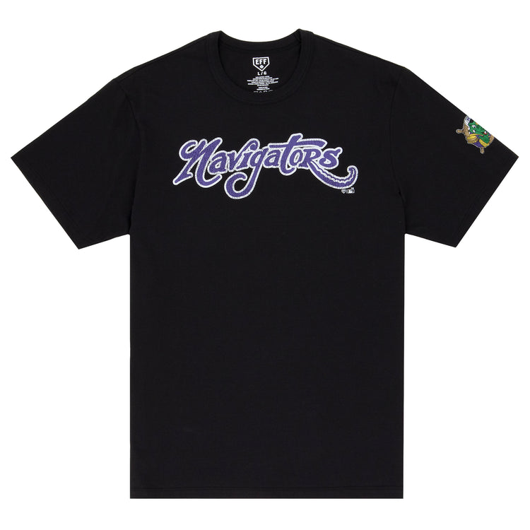 The Norwich Navigators EFF MiLB Vintage T-Shirt by Ebbets Field Flannels is a black tee with Navigators in bold purple and white script across the chest and a small colorful graphic on the left sleeve, inspired by classic Minor League styles.