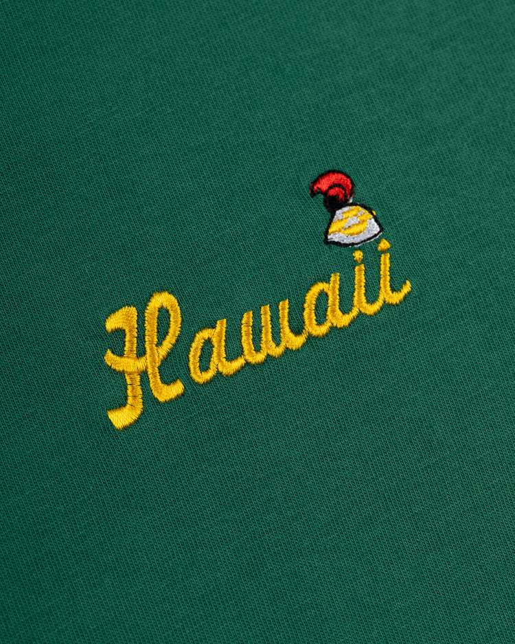 Ebbets Field Hawaii Islanders (PCL) Embroidered ‘Hawaii’ Short Sleeve Tee: green 200gsm cotton with Hawaii in yellow script and a red/yellow helmet above, inspired by the PCL legacy baseball tee.