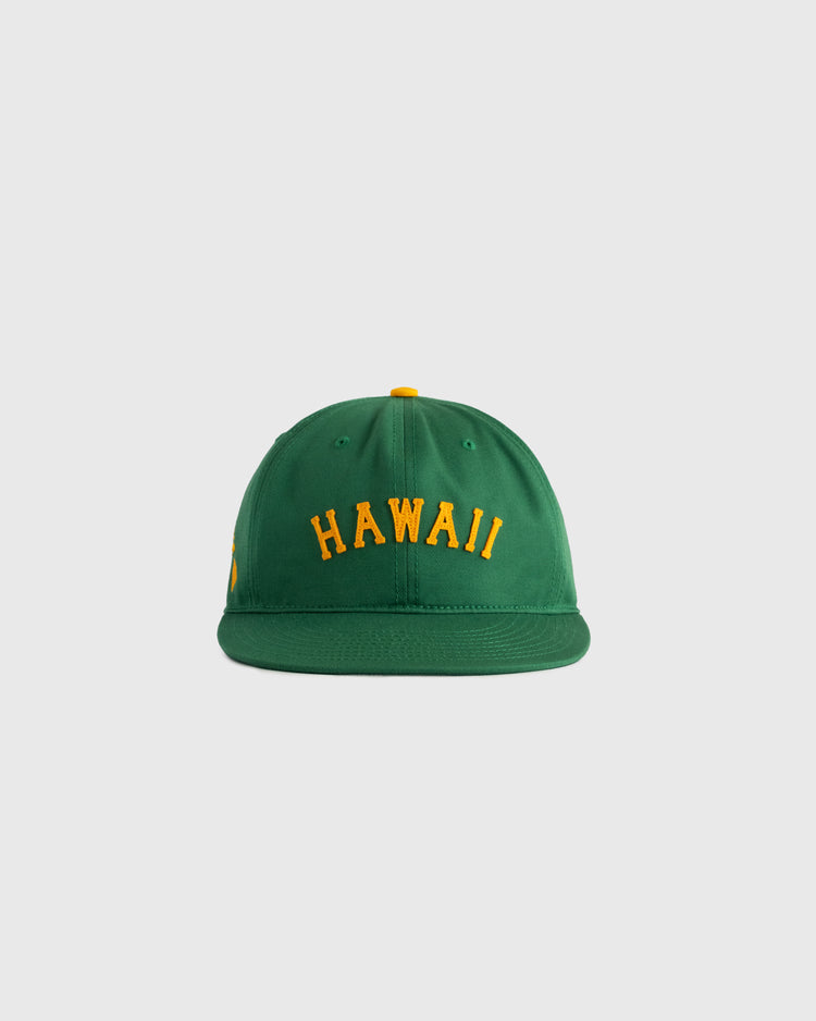 The Ebbets Field Hawaii Islanders (PCL) Cotton Twill Ballcap is a green vintage-style hat with HAWAII embroidered in yellow on the front, inspired by classic Islanders designs and shown on a plain light gray background.