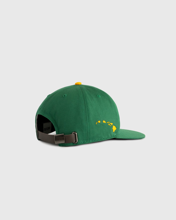 The Ebbets Field Hawaii Islanders (PCL) Cotton Twill Ballcap is a vintage green hat with a yellow top dot, yellow Hawaiian Islands outline on the back, and an adjustable metal strap. Shown on a plain light background.