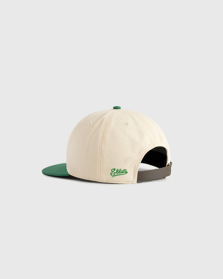The Ebbets Field Hawaii Islanders (PCL) Cotton Twill Ballcap features cream cotton twill, a green brim, rear Ebbets embroidery, vintage inspiration, an adjustable brown strap, and a green top button. Shown from the back.