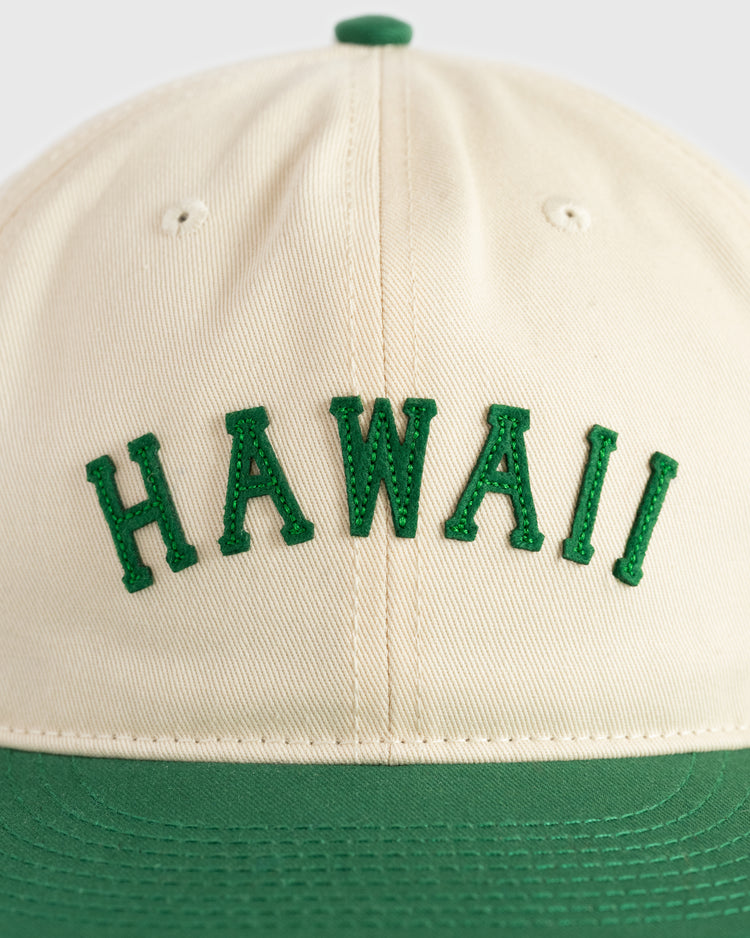 The Ebbets Field Hawaii Islanders (PCL) Cotton Twill Ballcap features cream cotton twill, green HAWAII embroidery on the front, a matching green bill, and vintage baseball cap styling.