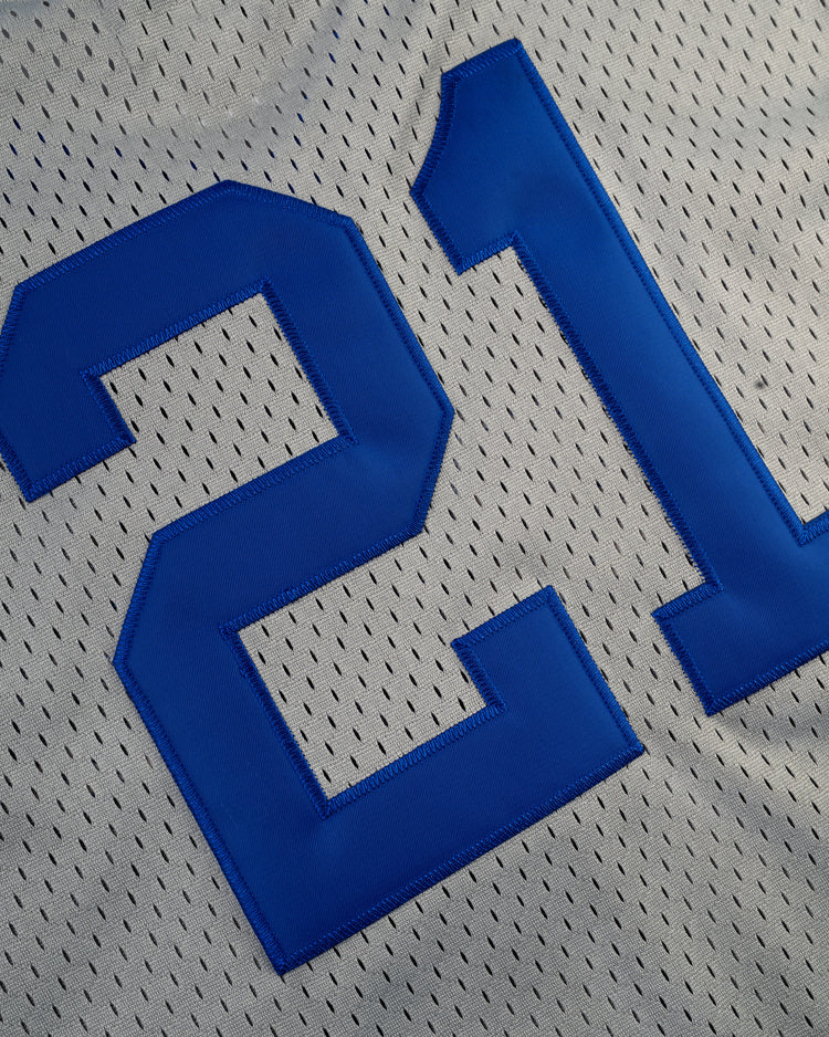 Close-up of the Ebbets Field Puerto Rico 1958 National Team Mesh V-Neck Jersey, featuring large blue number 21 and breathable perforated fabric.