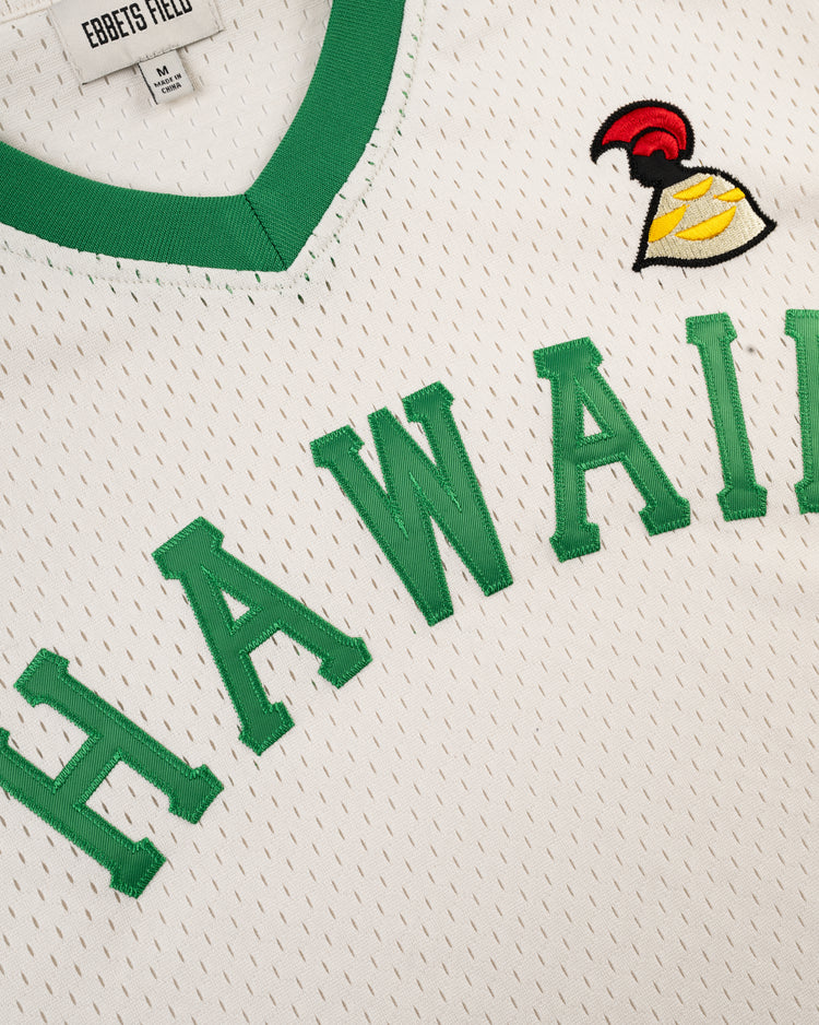 The Ebbets Field Hawaii Islanders (PCL) Mesh V-Neck Jersey is white with green trim, HAWAII in bold green letters, and a small embroidered yellow, red, and black helmet logo above the chest for a classic throwback look.
