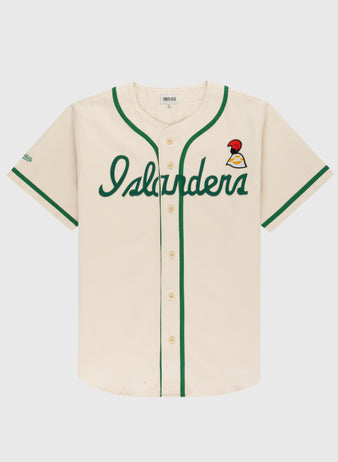 The Ebbets Field Hawaii Islanders (PCL) Cotton Twill Baseball Jersey features cream cotton twill, green trim, “Islanders” in green script on the front, a red and yellow bird patch on the left chest, and a classic button-up front.