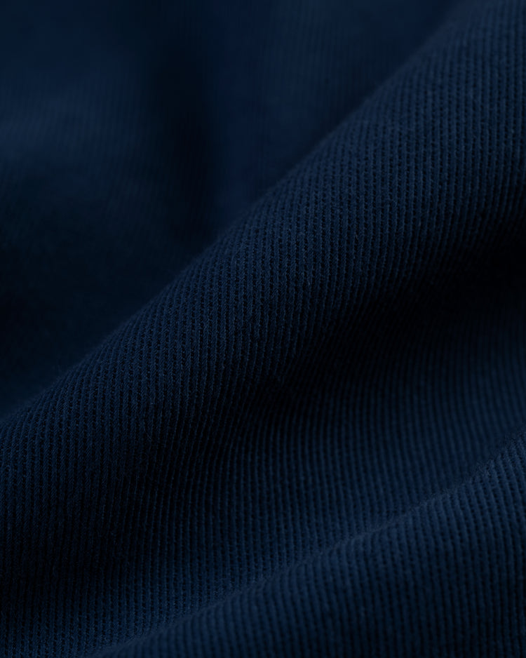 Close-up of the Hawaii Islanders (PCL) Cotton Linen Grounds Crew Short Sleeve Workshirt by Ebbets Field, highlighting the soft, textured cotton-linen blend with visible vertical ridges and gentle folds that add depth—ideal for summer workwear.