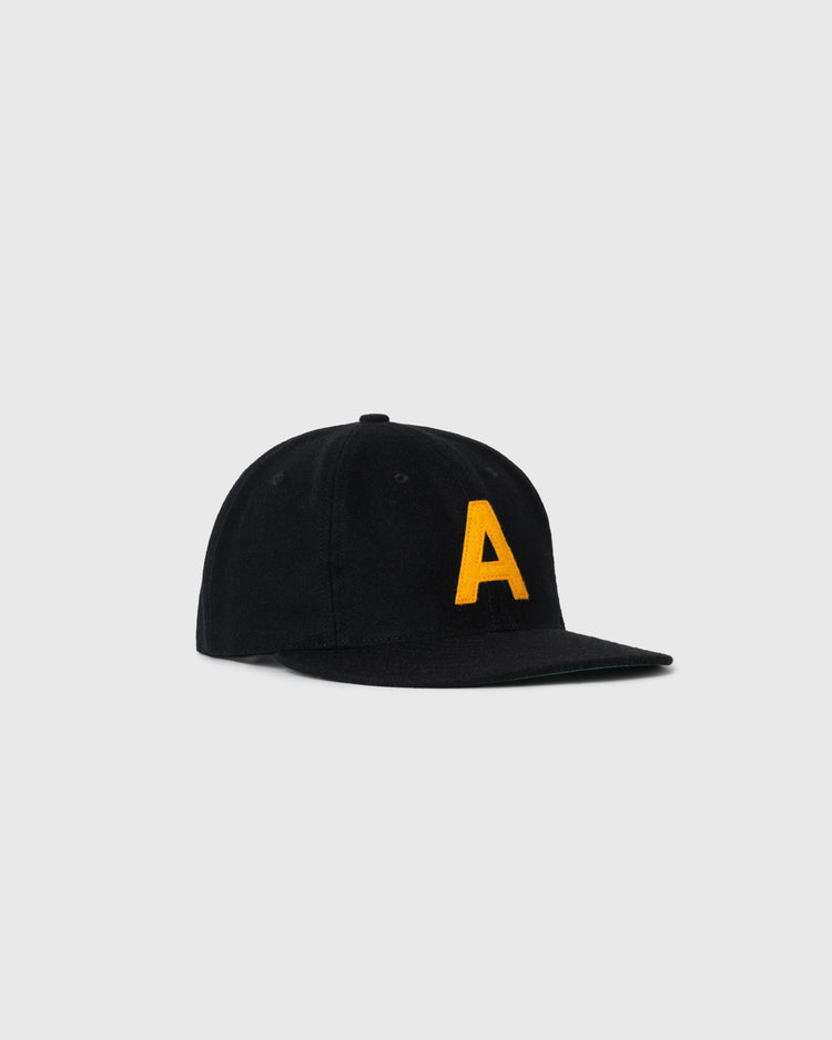 The EFF Army 1957 Authentic Wool Ballcap is black with a yellow A on the front and is displayed on a plain light gray background.