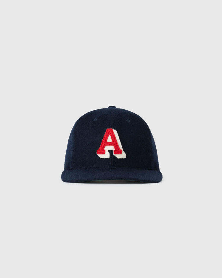 The EFF Atlanta Crackers 1939 Authentic Wool Ballcap features a navy blue design with a bold, red letter A outlined in white on the front, inspired by vintage baseball caps, shown against a plain light gray background.
