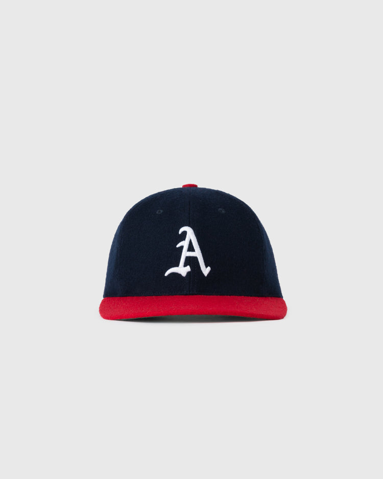 The EFF Atlanta Crackers 1956 Authentic Wool Ballcap features navy blue wool, a red brim, and a white embroidered A, displayed on a plain light gray background.