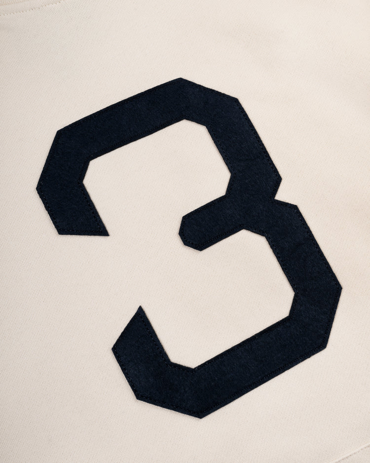 A large, black number three is stitched onto cream cotton fabric on the EFF Babe Ruth Cotton French Terry Pullover Hoodie, evoking classic baseball style.
