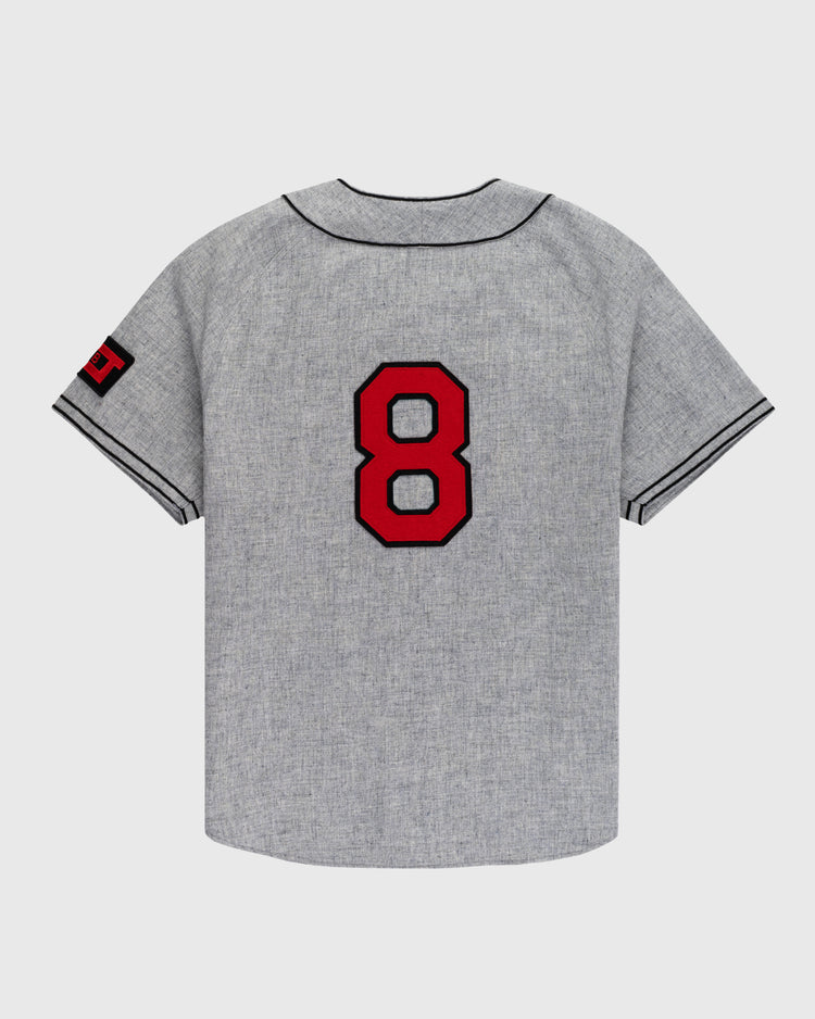 The Ebbets Field Birmingham Black Barons 1948 Authentic Wool Road Baseball Jersey features gray wool with black trim, a bold red and black number 8 on the back, and sleeve detailing—honoring Willie Mays as seen at the Negro Leagues Baseball Museum.