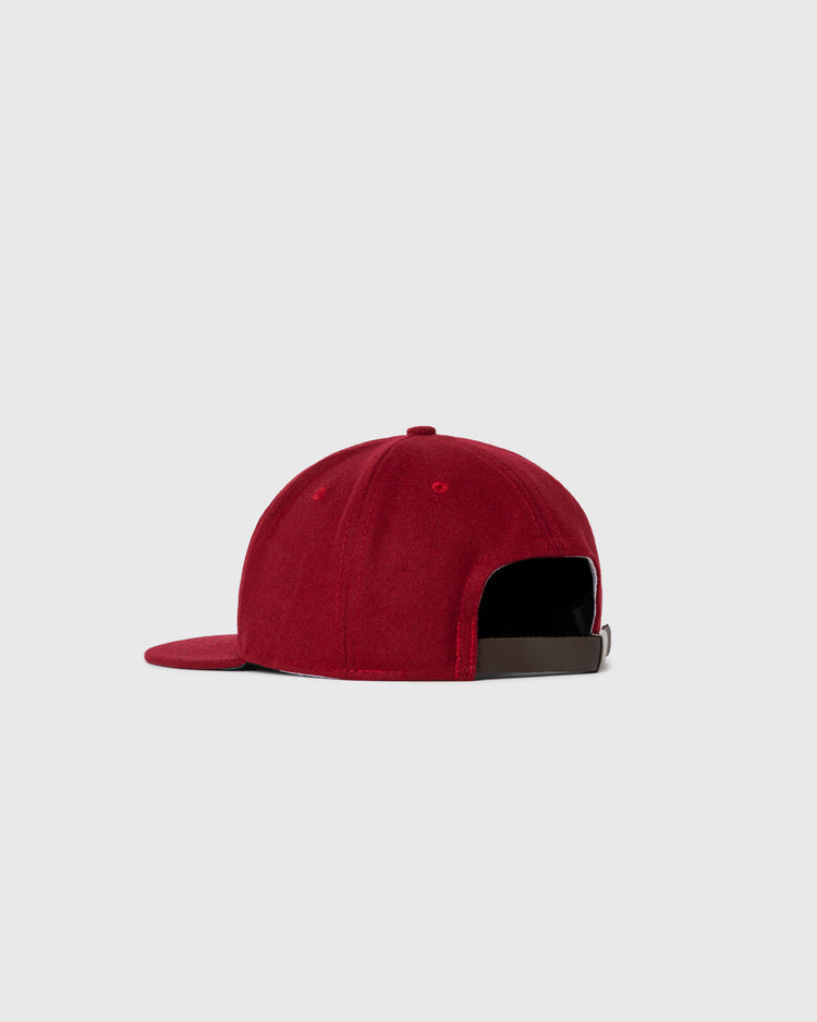The EFF Brooklyn College 1947 Authentic Wool Ballcap is a red vintage cap with a curved brim and adjustable brown strap, shown from the back against a plain light gray background.