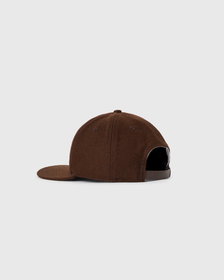 The EFF Brown University 1959 Authentic Wool Ballcap is shown from the side, featuring a curved brim and adjustable strap, set against a plain light gray background.