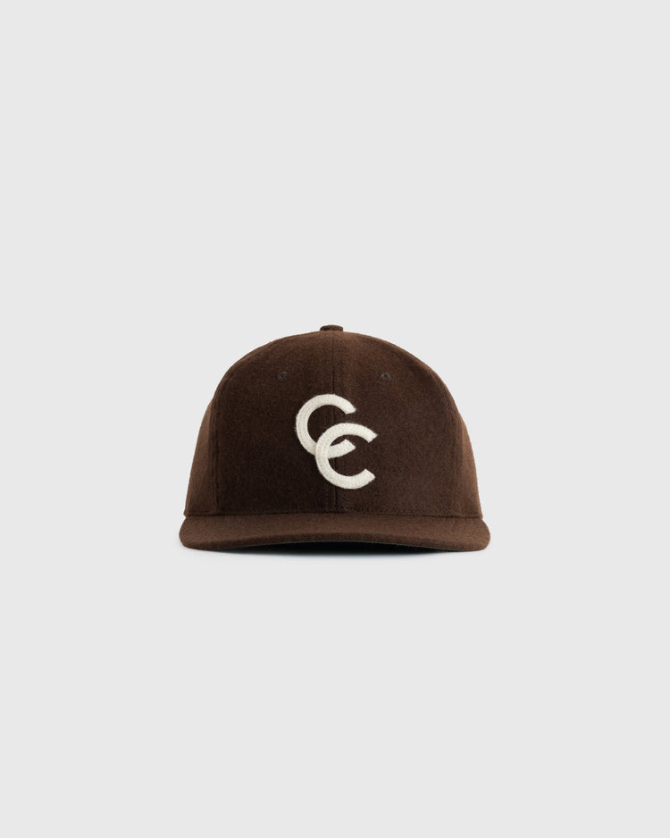 The EFF Cordoba Cafeteros 1957 Authentic Wool Ballcap is a brown hat with a white overlapping CC logo, inspired by Mexican baseball history and shown on a plain white background.
