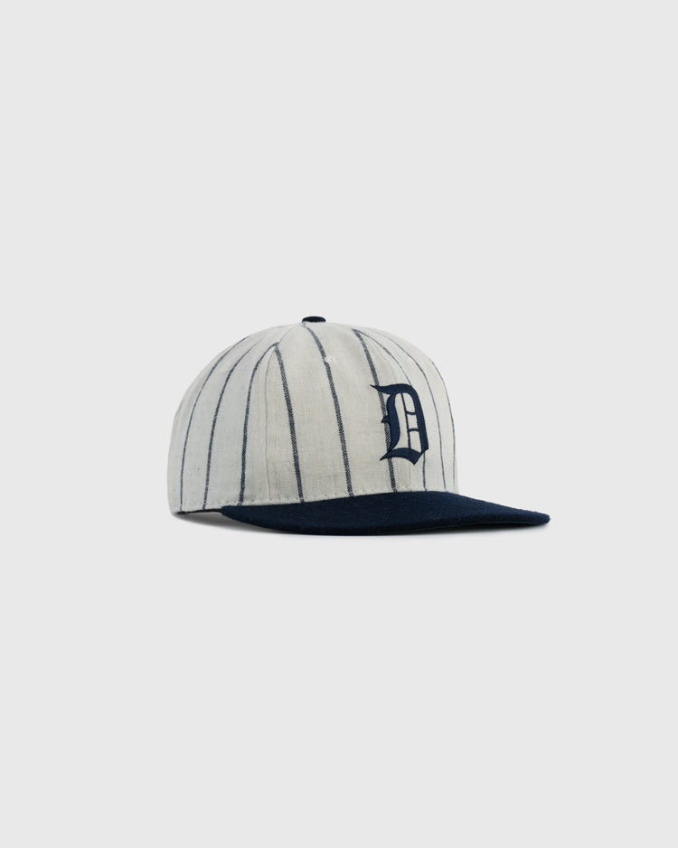 The EFF Duke University Pinstripe Authentic Wool Ballcap features black vertical pinstripes, a navy brim, and a bold black D, inspired by the 1968 Duke cap, shown against a plain light gray background.