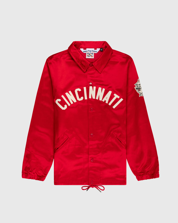 The EFF Cincinnati Reds 1955 Satin Windbreaker Jacket features bright red satin, bold white “CINCINNATI” lettering, a left sleeve patch, button front, drawstring hem, side pockets, and pointed collar—vintage MLB style.