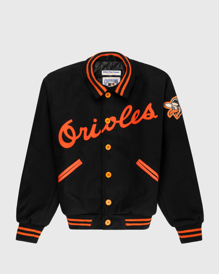 The EFF Baltimore Orioles 1966 Authentic All Wool Varsity Jacket features black wool, orange Orioles script, orange buttons, striped cuffs and collar, plus a sleeve bird logo patch—an authentic World Series replica.