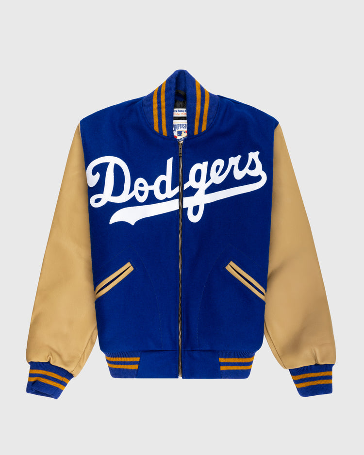 The EFF Brooklyn Dodgers 1951 Authentic Wool & Leather Varsity Jacket has a blue body, tan sleeves, striped cuffs and waistband, and large white Dodgers script—ideal for fans of classic Brooklyn Dodgers style.