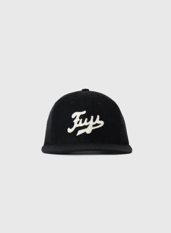 The Fuji Athletic Club 1931 Authentic Wool Ballcap by EFF features black genuine wool and a white cursive Fuy logo on the front, paying homage to Japanese-American baseball history. Displayed on a plain light gray background.