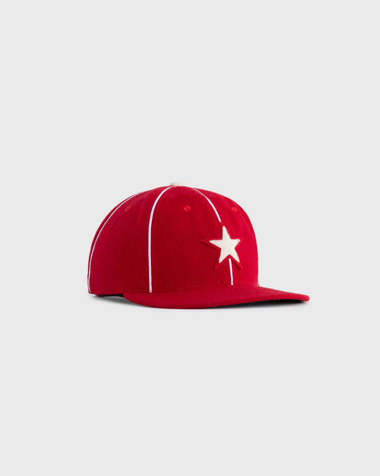 The EFF Hollywood Stars 1940 Authentic Wool Ballcap features a red design with white seams and a front star emblem, faithfully replicating the classic Pacific Coast League cap and shown on a light gray background.