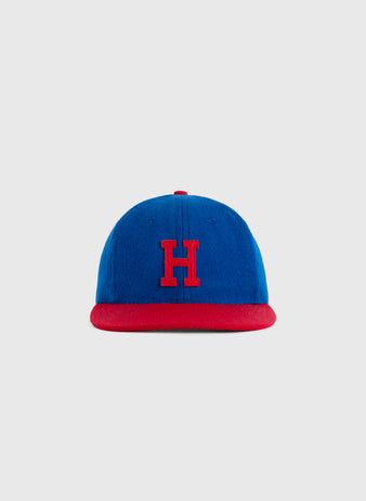 The EFF Hollywood Stars 1949 Authentic Wool Ballcap features blue wool, a red brim, and a red embroidered H, celebrating the Pacific Coast League team—shown here against a plain light gray background.