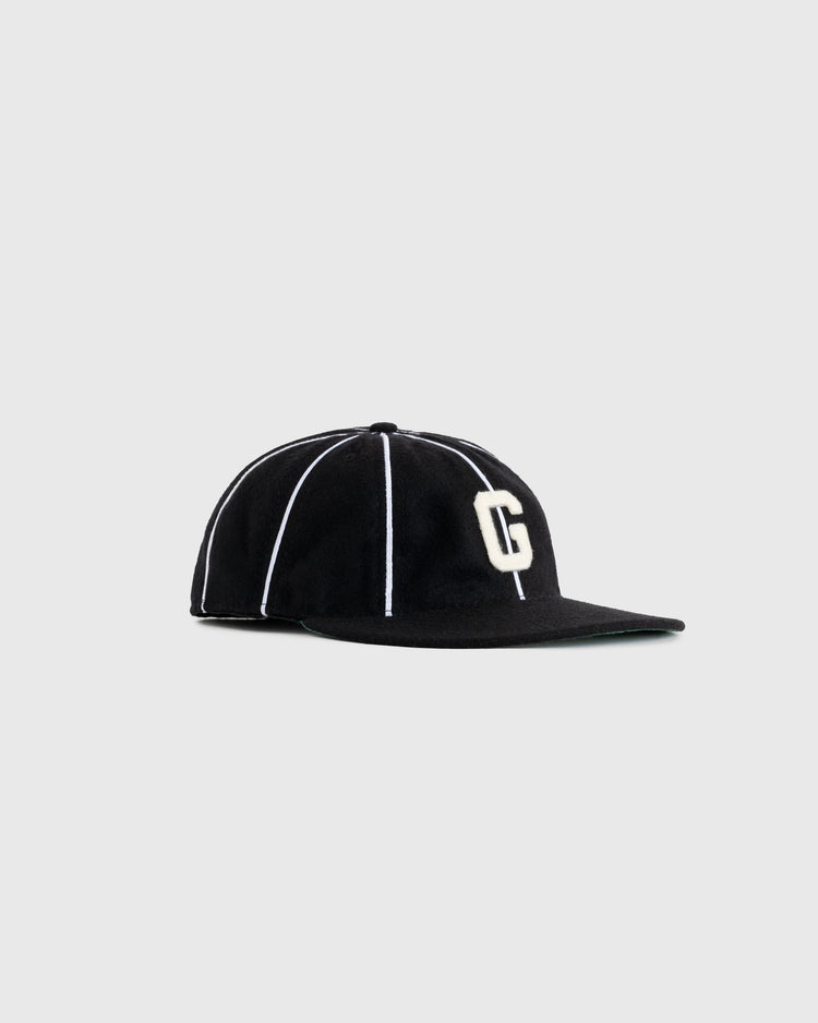 The EFF Homestead Grays 1939 Authentic Wool 8-Panel Ballcap features black wool, white vertical piping, and a raised white G on the front, shown against a light gray background to honor Negro Leagues baseball history.