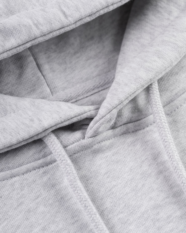 Close-up of the Ebbets Field Flannels Homestead Grays Heavyweight Cotton Terry Pullover Hoodie, showing the hood, drawstrings, visible stitching, and soft texture—crafted in tribute to the Negro Leagues.