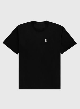 The Ebbets Field Flannels Homestead Grays Embroidered G Short Sleeve Tee features a small white G on the left chest, honoring Josh Gibson and the Homestead Grays, shown against a light gray background.