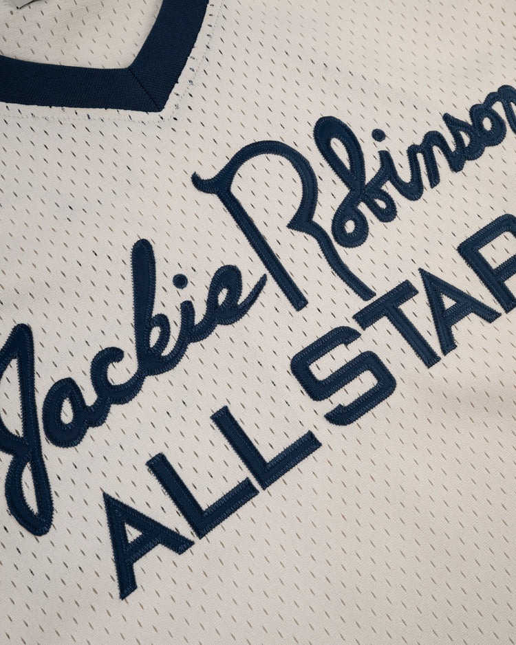 The Ebbets Field Jackie Robinson Mesh V-Neck Jersey features bold ALL STAR lettering, his signature script, and classic blue trim—a throwback tribute to baseball history.